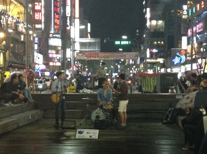 She's somewhere far in the background, not yet drunk enough to attack foreigners. 